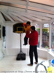 Boy and Dad plaing bascketball