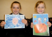 Alexandria McLelland and Liberty MacLeod with their winning paintings for Junior Painter of the Year competition