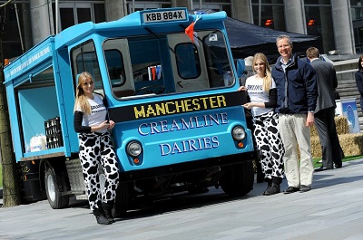 Creamline Dairies joint MD Chris Swallow with promo girls and Manchester float