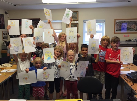 Kids show their work at the Cartoon Academy workshop