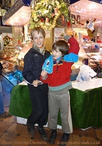 kids having fun on Christmas market