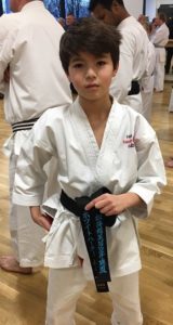 MGS student Hugo Whitehurst with his newly acquired black belt (large image)