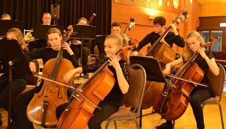 Alex Jones with the school orchestra