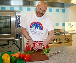 Simon Rimmer demonstrates his culinary skills in the new kitchen at Francis House.