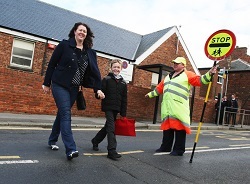 A family crossing street safely | Walk to School Week, Manchester