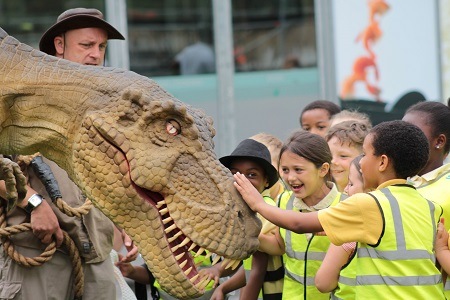 Year 3 pupils from Lark Hill Community Primary School, Salford, enjoy meeting the T-Rex