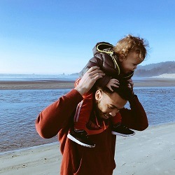 Spending summer holidays with kids at the beach | A father and a child