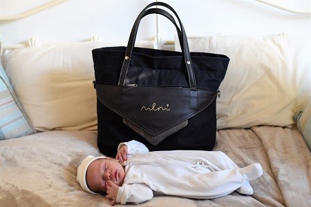 Sleeping baby and maternity bag