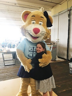 Liberty the Lioness, new AESG junior mascot with one of the pupils