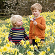 Children, playing in daffodil field