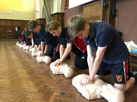 Pupils learning resuscitation at the first aid classes at Hulme Hall Grammar School