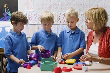 Children with teacher at school