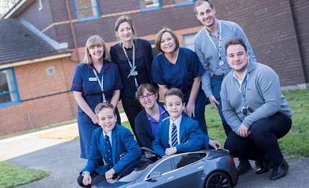 Alex and James Price, have donated their mini Tesla Model S to the Countess of Chester Hospital