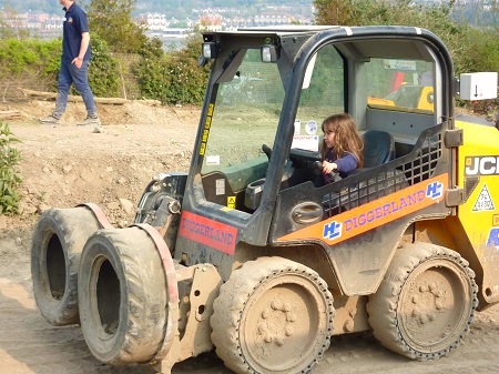 Heidi drives a robot at Diggerland