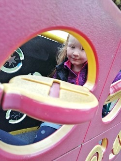 Playing noughts and crosses on the frame in the park