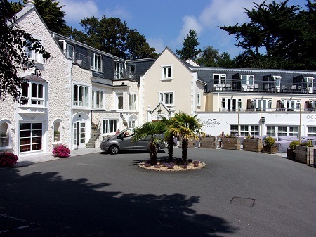 Fermain Valley Hotel with electric Nissan taxi in front, Guernsey, near St Peter Port