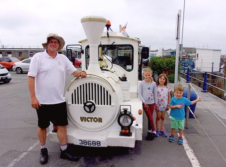 Le Petit Train called Victor, it's driver Andy Furniss and little kids-passengers, Harriett, Heidi and Henry Saunders