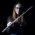 Kings Alumna Alex Clarke with her flute