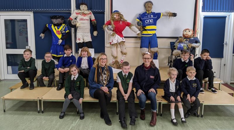 Children with their sporting scarecrows and Tatton Park