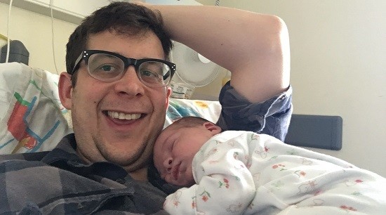 Happy new Dad with baby