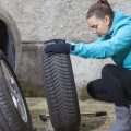 Female changing tyre
