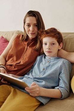 Mother and son with computer