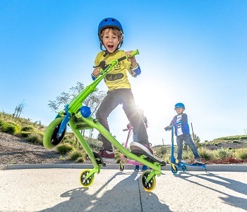 Child making wheelie on Y Fliker scooter