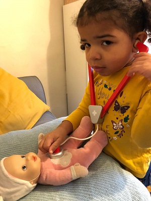 Little girl playing a doctor