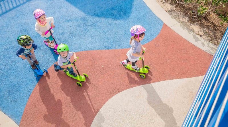 Kids riding Yvolution Glider Scooters