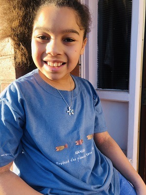 Boy wearing t-shirt and necklace