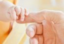 Mother & Baby holds fingers- baby skin feelings