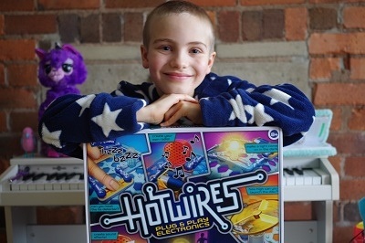 Boy with John Adams's Hot Wires electronics kit