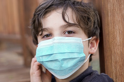 Boy wearing face mask during COVID19 by park-RnAcIEfDvhQ from unsplash