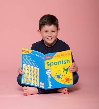 Boy with Collins easy learning Spanish