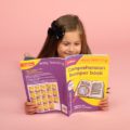 Girl with Collins's comprehension bumper book