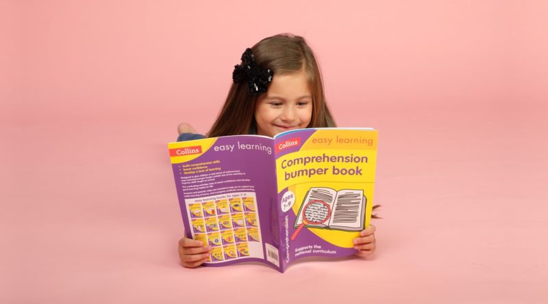 Girl with Collins's comprehension bumper book