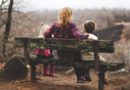 Mum with 2 kids on a bench, photo by Benjamin Manleyfrom