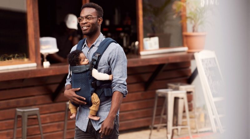 Father with a baby in a babybjorn mesh baby carrier