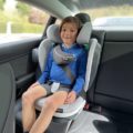 a boy in BeSafe iZi Flex FIX i Size booster seat