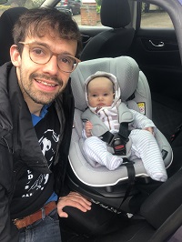 Dad with baby in a car seat