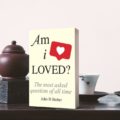 book Am I Loved on a tea table