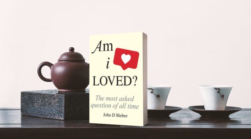book Am I Loved on a tea table