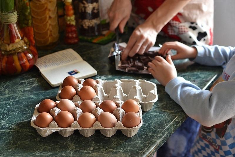 Parent and child cooking together