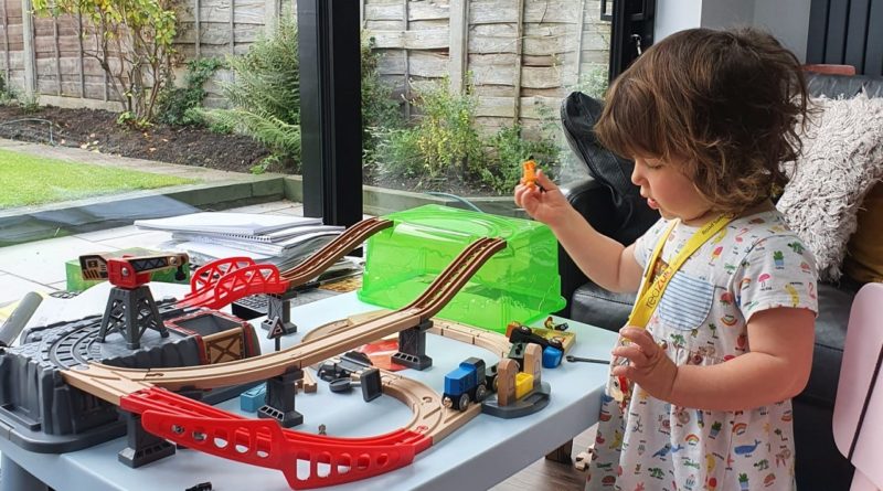 Girl playing with The Railway Bucket Builder set