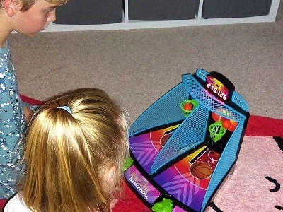 Kids playing Ambassador Games Electronic Arcade Basketball