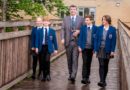Jason Slack, Head of Foundation at The King's School in Macclesfield, with pupils on the school's bridge
