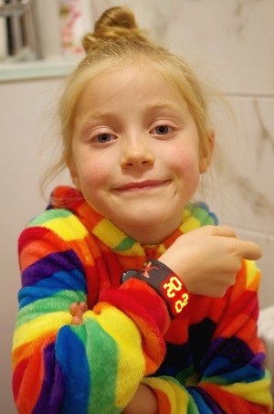 Girl with SnapWatch in the bathroom