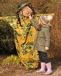 Child with Scarecrow at Tatton park