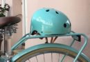 Bobbin's green Starling bike helmet on a bicycle seat.