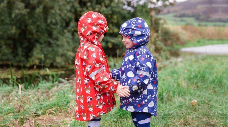 Kids under the rain in Blade and Rose Colour Changing Raincoats